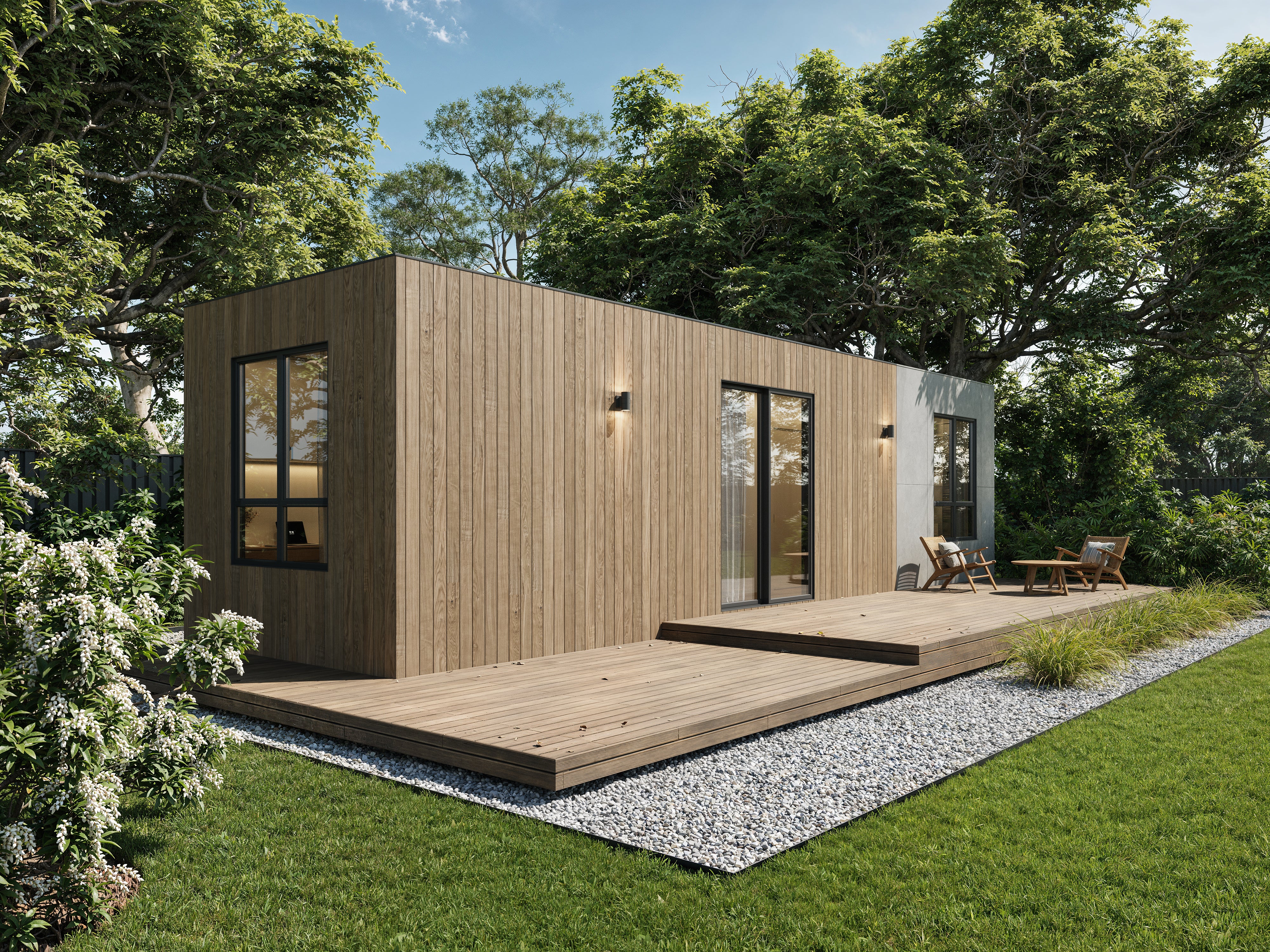 Modern wooden cabin with a deck surrounded by greenery